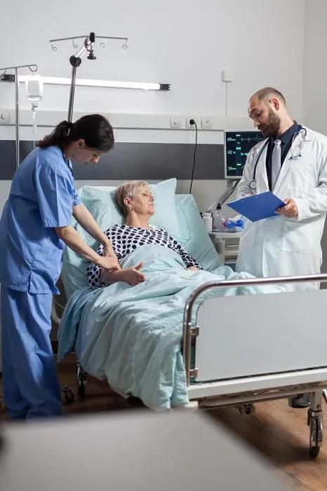 Framed Print : Senior woman laying in hospital bed receiving medication through an intravenous line Framed Print : Senior woman laying in hospital bed receiving medication through an intravenous line
