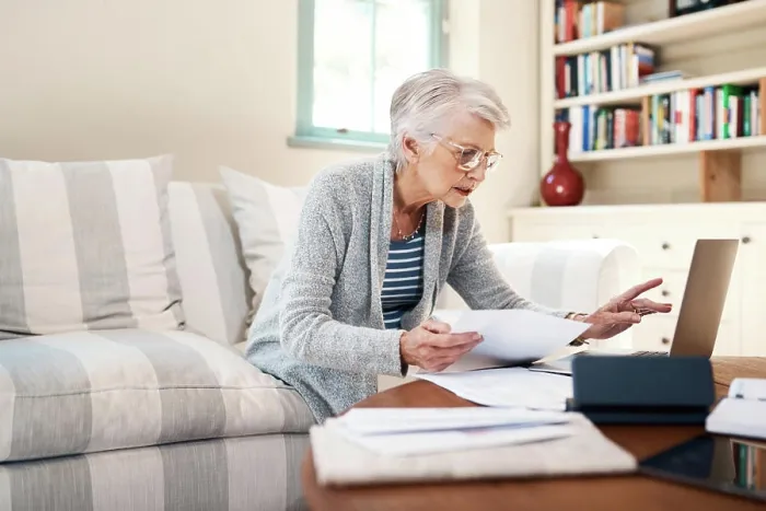 Framed Print : Senior woman, paperwork and laptop for insurance in home Framed Print : Senior woman, paperwork and laptop for insurance in home