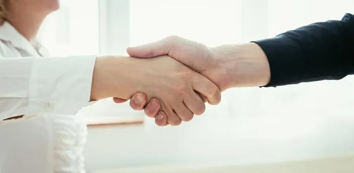 Framed Print : Shaking hands, concept for teamwork: Close up of man and woman shaking hands in the office Framed Print : Shaking hands, concept for teamwork: Close up of man and woman shaking hands in the office