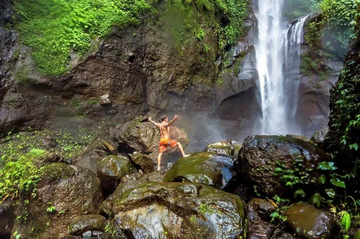 Framed Print : Shirtless man in shorts standing on rocks near waterfall, Kintamani, Bali, Indonesia Framed Print : Shirtless man in shorts standing on rocks near waterfall, Kintamani, Bali, Indonesia