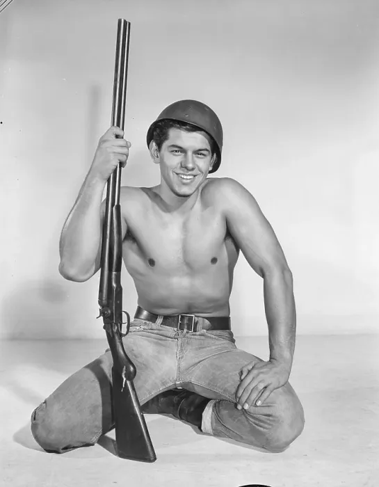Framed Print : Shirtless Young Soldier with Rifle c.1959 Framed Print : Shirtless Young Soldier with Rifle c.1959
