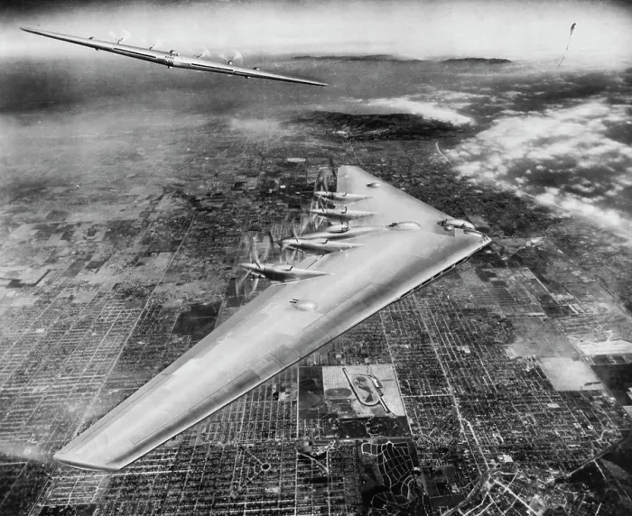 Framed Print : Shown here is an artist's conception of the Northrop Flying Wing XB-35 in flight over Los Angeles