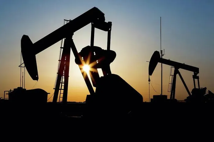 Framed Print : Silhouette of a pumpjack with sunburst at sunrise; Acme, Alberta, Canada