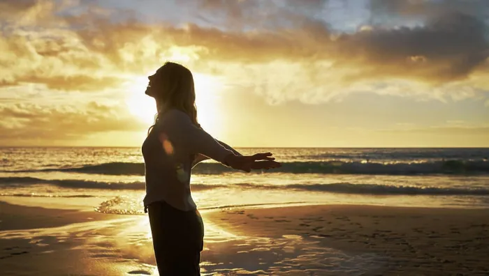 Framed Print : Silhouette of a woman on the beach at sunset outside Framed Print : Silhouette of a woman on the beach at sunset outside