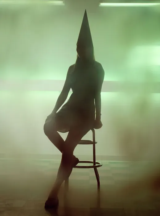 Framed Print : Silhouette of a woman wearing a dunce cap and sitting on a bar stool Framed Print : Silhouette of a woman wearing a dunce cap and sitting on a bar stool