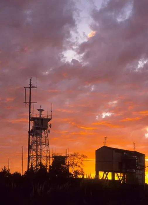 Framed Print : Silhoulette of communication towers against an orange sunset Framed Print : Silhoulette of communication towers against an orange sunset