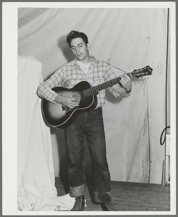 Framed Print : Singing cowboy songs at entertainment at the FSA (Farm Security Administration) mobile camp for migratory farm workers