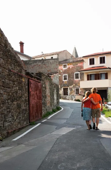 Framed Print : Slovenia - Rear view of a young couple strolling down a walkway in an Old World village. (MR) Framed Print : Slovenia - Rear view of a young couple strolling down a walkway in an Old World village. (MR)