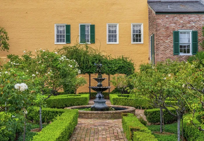 Framed Print : Small tree filled garden in French Quarter of New Orleans Small garden with brick paths
