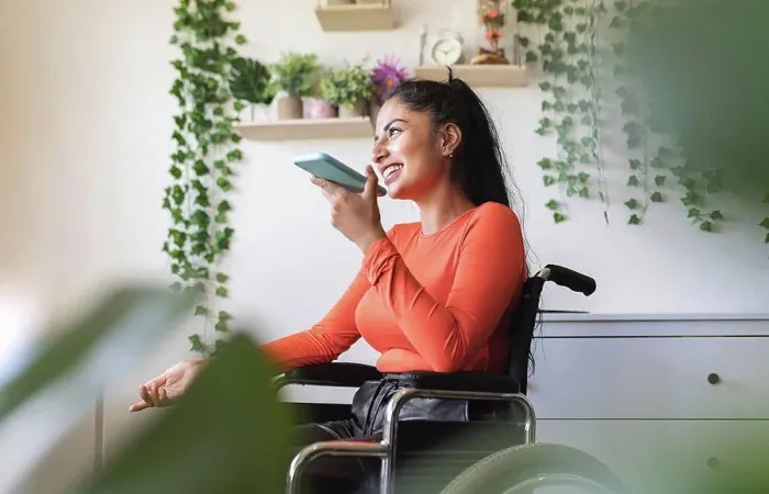 Framed Print : Smiling disabled woman talking on mobile phone at home Framed Print : Smiling disabled woman talking on mobile phone at home