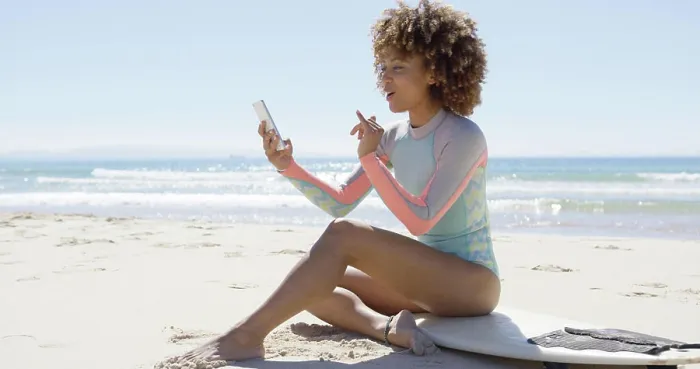 Framed Print : Smiling female on beach using smartphone Smiling female sitting on surfboard on beach using smartphone on sea Framed Print : Smiling female on beach using smartphone Smiling female sitting on surfboard on beach using smartphone on sea