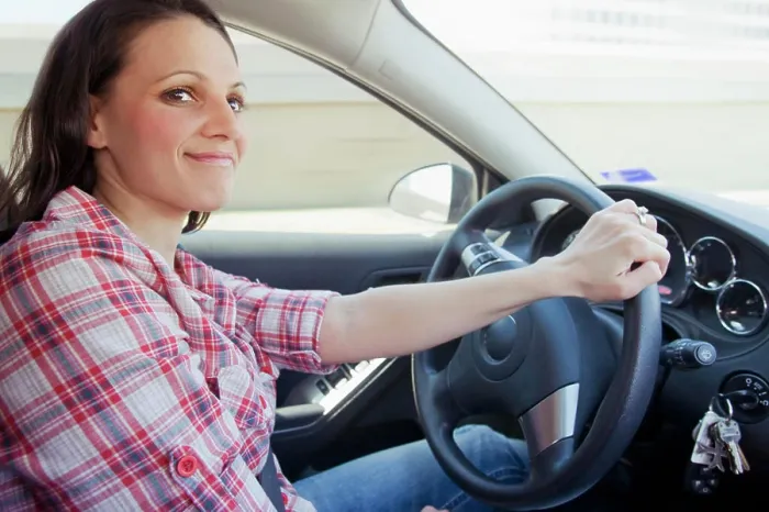 Framed Print : Smiling woman driving car Framed Print : Smiling woman driving car