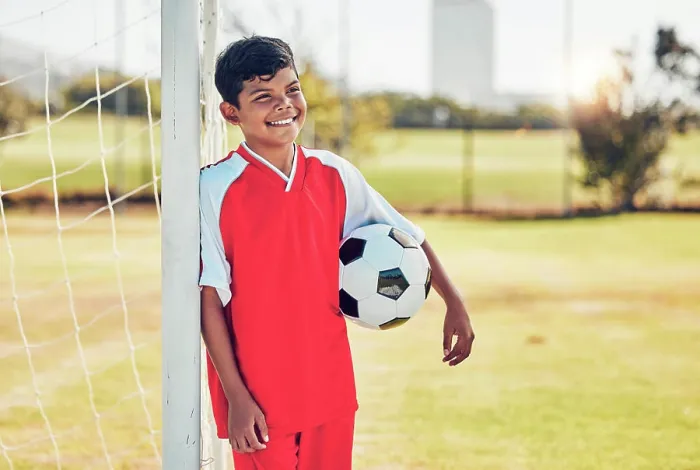 Framed Print : Soccer player, field and child with happy game Framed Print : Soccer player, field and child with happy game