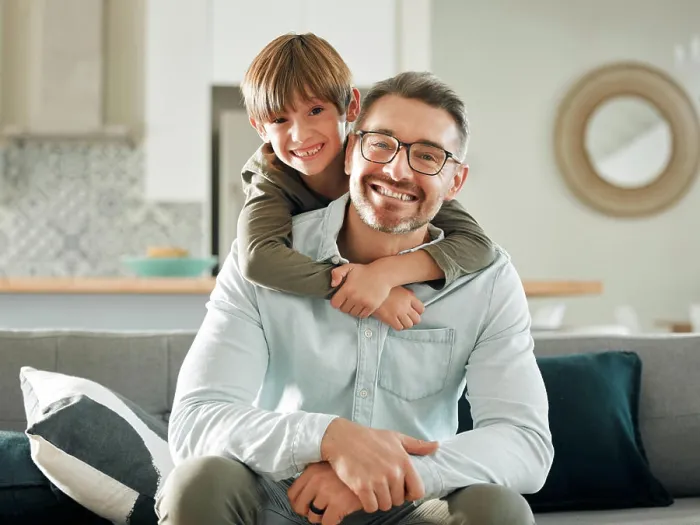 Framed Print : Sofa, son and hugging father in portrait Framed Print : Sofa, son and hugging father in portrait