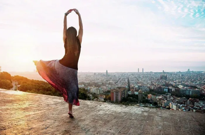 Framed Print : Spain, Barcelona, Woman ldancing at view point over city Framed Print : Spain, Barcelona, Woman ldancing at view point over city