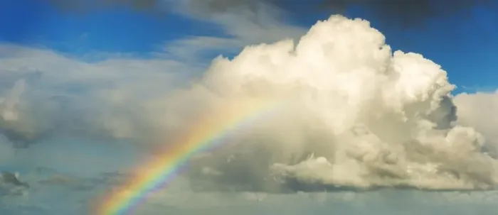 Framed Print : Spectacular rainbow in bright colors rising up to a huge white cloud with blue sky Framed Print : Spectacular rainbow in bright colors rising up to a huge white cloud with blue sky