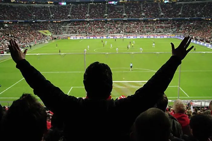 Framed Print : Spectators in a stadium during a football match
