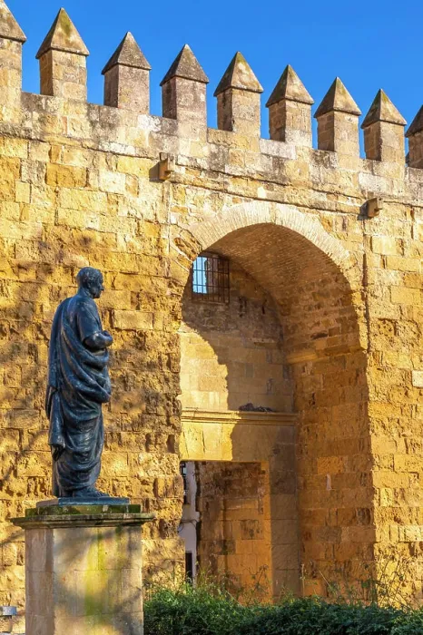 Framed Print : Statue of Seneca with the Almodovar Gate and Walls of Cordoba built in the Caliphate Period