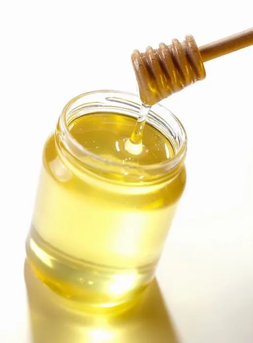 Framed Print : Stirrer in jar of honey Framed Print : Stirrer in jar of honey