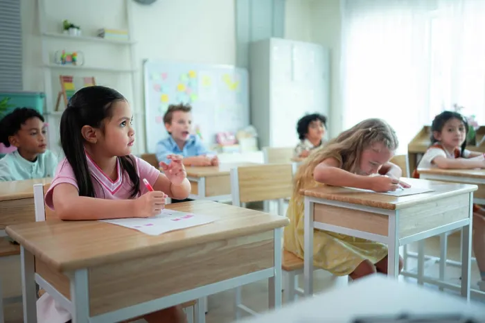 Framed Print : Students learn and study in a classroom of school where youngsters sit and listen attentively Framed Print : Students learn and study in a classroom of school where youngsters sit and listen attentively