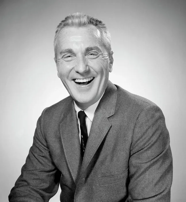 Framed Print : Studio portrait of businessman laughing Framed Print : Studio portrait of businessman laughing