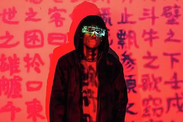 Framed Print : Studio portrait with red neon lights of a futuristic man with AR goggles in a wall with chinese words Framed Print : Studio portrait with red neon lights of a futuristic man with AR goggles in a wall with chinese words