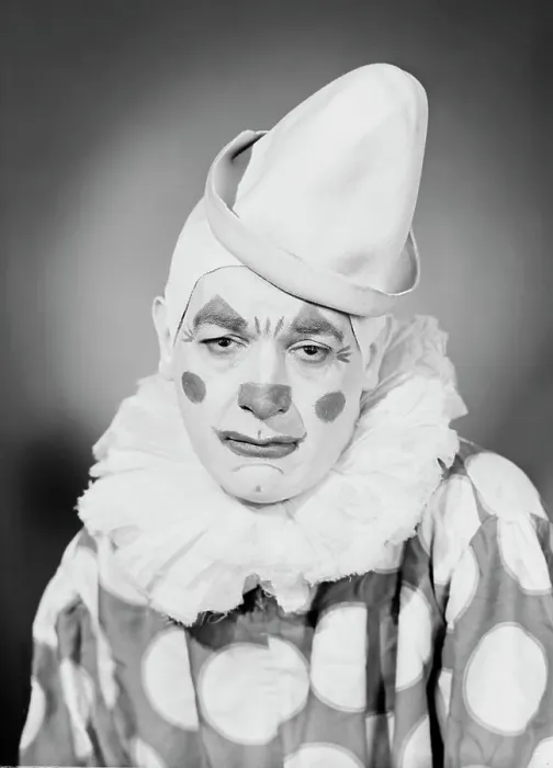 Framed Print : Studio portrait of sad clown