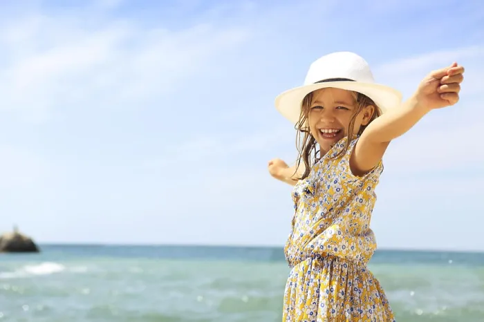 Framed Print : Summer vacation concept. Smiling girl with arms wide open Framed Print : Summer vacation concept. Smiling girl with arms wide open