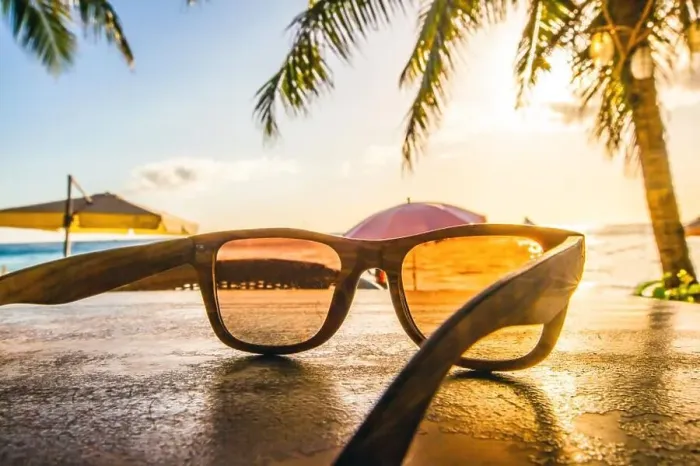 Framed Print : Sunglasses on beach. Sunglasses on tropical beach with palms at sunset Framed Print : Sunglasses on beach. Sunglasses on tropical beach with palms at sunset