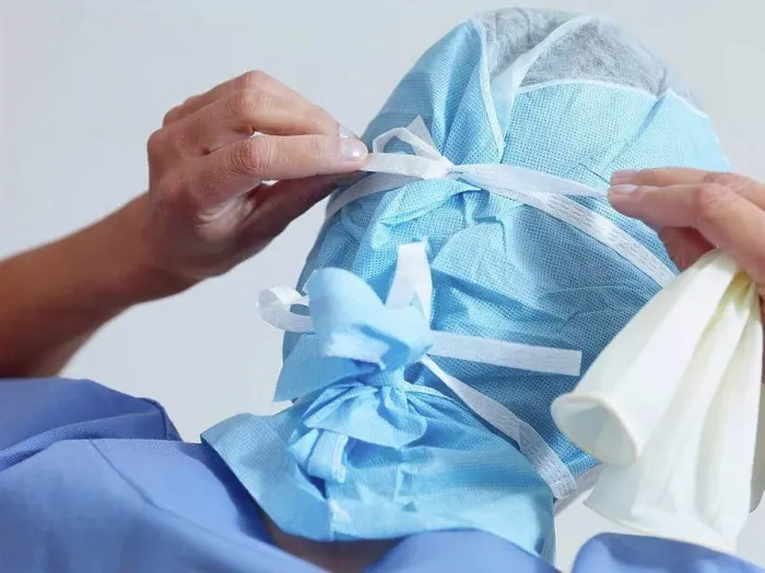 Framed Print : Surgeon putting on surgical mask Framed Print : Surgeon putting on surgical mask
