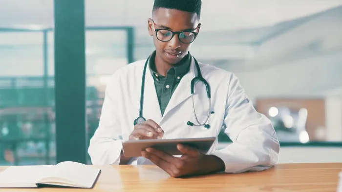 Framed Print : Tablet, black man and doctor in hospital with medical research for treatment planning Framed Print : Tablet, black man and doctor in hospital with medical research for treatment planning