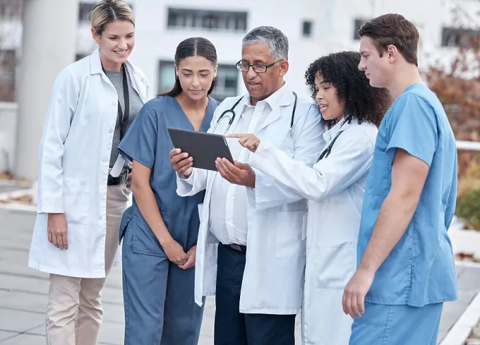 Framed Print : Tablet, doctors and medical people at hospital outdoor with clinic management Framed Print : Tablet, doctors and medical people at hospital outdoor with clinic management