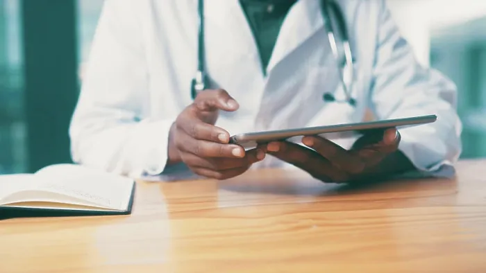 Framed Print : Tablet, notebook and hands of doctor in clinic with medical research for treatment planning
