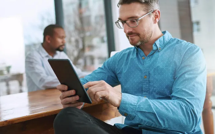 Framed Print : Tablet, reading and businessman in office with research online for finance stock market investment Framed Print : Tablet, reading and businessman in office with research online for finance stock market investment