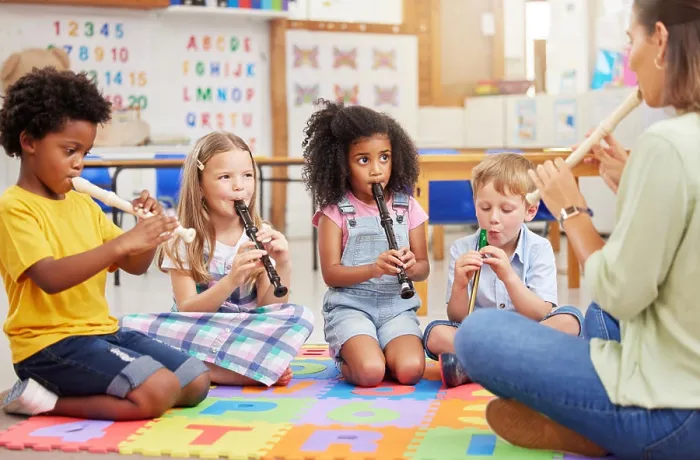 Framed Print : Teacher, flute and students in classroom