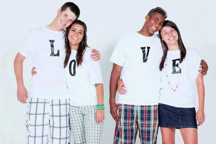 Framed Print : teenage couples with their t_shirts spelling ´love´