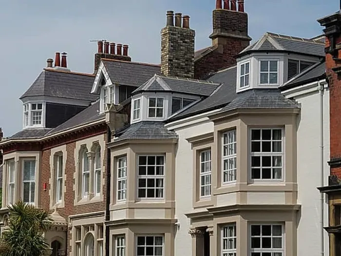 Framed Print : Terraced houses with large windows and tiled roofs in an urban environment, tynemouth, England, United Kingdom, Europe