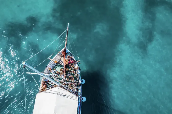 Framed Print : Tisno, Croatia - 9AUGUST 2019: Aerial view of a boat in the turquoise waters Framed Print : Tisno, Croatia - 9AUGUST 2019: Aerial view of a boat in the turquoise waters