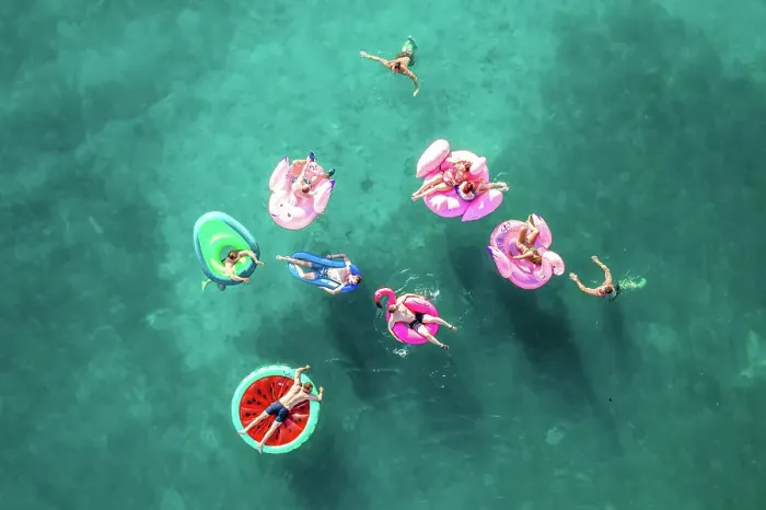 Framed Print : Tisno, Croatia - 9AUGUST 2019: Aerial view of people floating in the turquoise waters Framed Print : Tisno, Croatia - 9AUGUST 2019: Aerial view of people floating in the turquoise waters