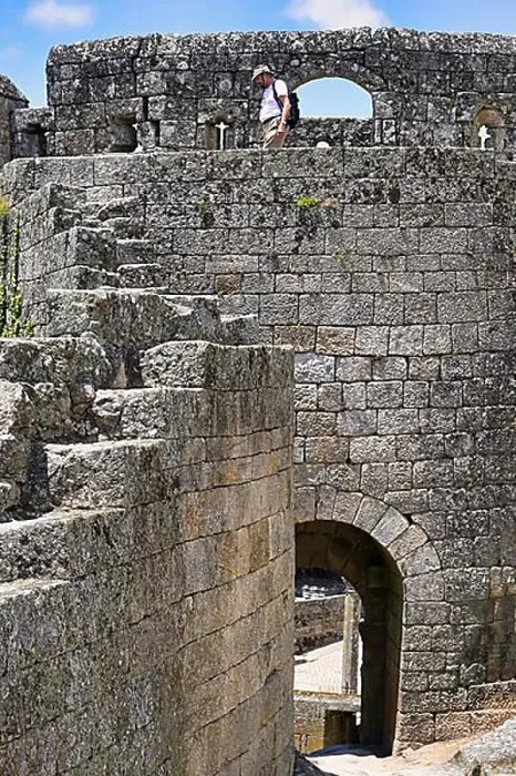 Framed Print : Tourist walking on the Castle ramparts, Sortelha, Serra da Estrela, Beira Alta, Portugal, Europe Framed Print : Tourist walking on the Castle ramparts, Sortelha, Serra da Estrela, Beira Alta, Portugal, Europe