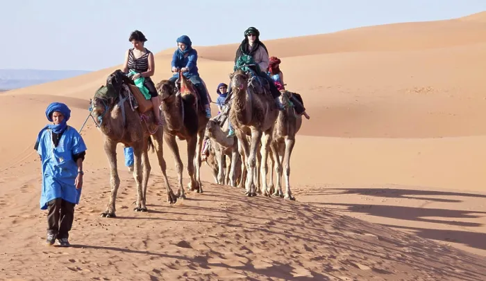 Framed Print : Tourists on camel tour, Sahara desert, Morocco Framed Print : Tourists on camel tour, Sahara desert, Morocco