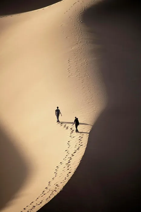 Framed Print : Tourists leaving footprints while walking on sand dune in Sahara Desert