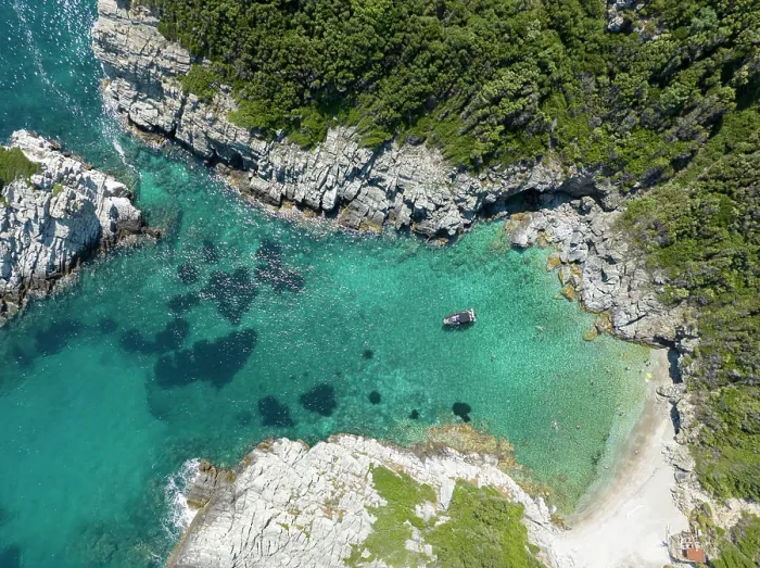Framed Print : Tourists swim in a cove along the Greek Island of Skopelos Framed Print : Tourists swim in a cove along the Greek Island of Skopelos