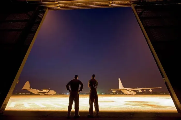 Framed Print : Two United States Marine aviators scan the flight line on which two KC-130J Super Hercules sit parked at Kuantan Air Framed Print : Two United States Marine aviators scan the flight line on which two KC-130J Super Hercules sit parked at Kuantan Air