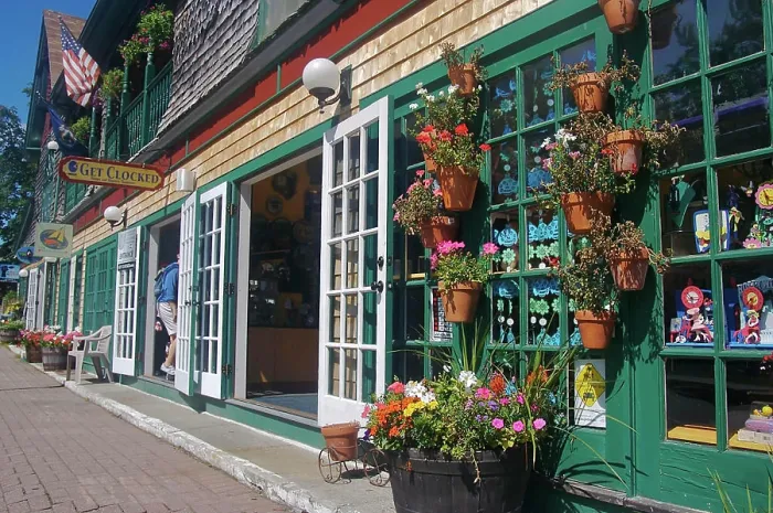Framed Print : USA, Maine, Bar Harbor. Colorful Bar Harbor storefronts and potted flowers