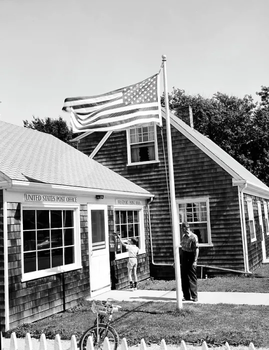 Framed Print : USA, Massachusetts, Westport, Boy dropping mail in mailbox with mature man standing behind him
