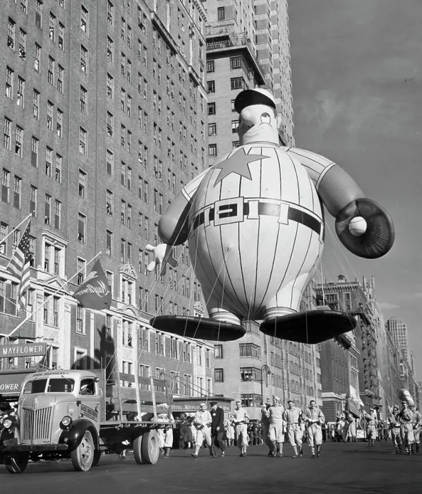 Framed Print : USA, New York State, New York City, Macy's Thanksgiving Day Parade holding baseball player balloon, 1946