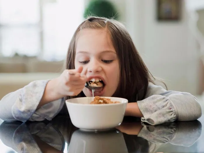 Framed Print : USA, Utah, Alpine, portrait of girl (8-9) eating breakfast