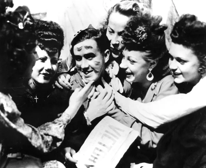 Framed Print : VE Day celebrations, Paris, 8 May 1945. A soldier smothered with kisses by jubilant women. The photographer is unknown Framed Print : VE Day celebrations, Paris, 8 May 1945. A soldier smothered with kisses by jubilant women. The photographer is unknown