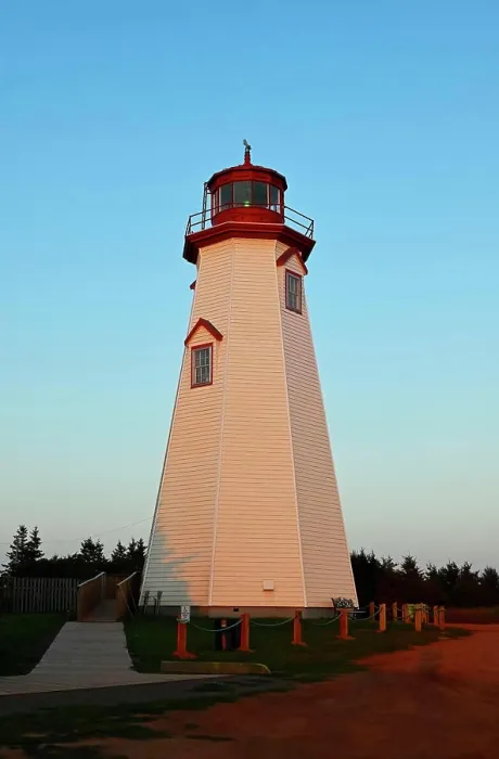 Framed Print : A vertical image of the famous tourist attraction Seacow Head Lighthouse Prince Edward Island in the evening light of